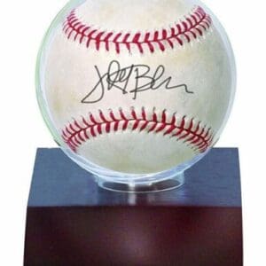 Signed baseball in display case.