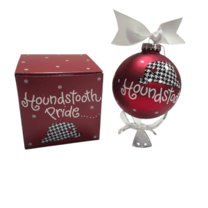 Houndstooth Pride ornament in red box.